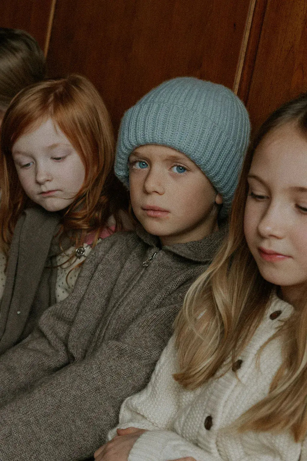 Boy wearing Lalaby Woody beanie in dove blue cashmere