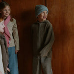 Boy wearing Lalaby Woody beanie in dove blue cashmere