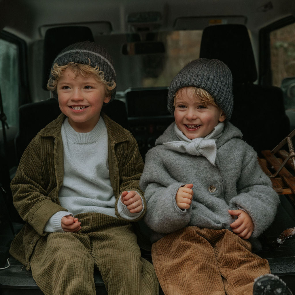 Boy wearing Lalaby Woody beanie in storm grey cashmere