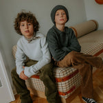 Boy wearing Lalaby Woody beanie in storm grey cashmere