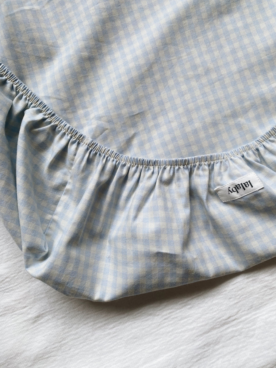 Pusleunderlag blå gingham