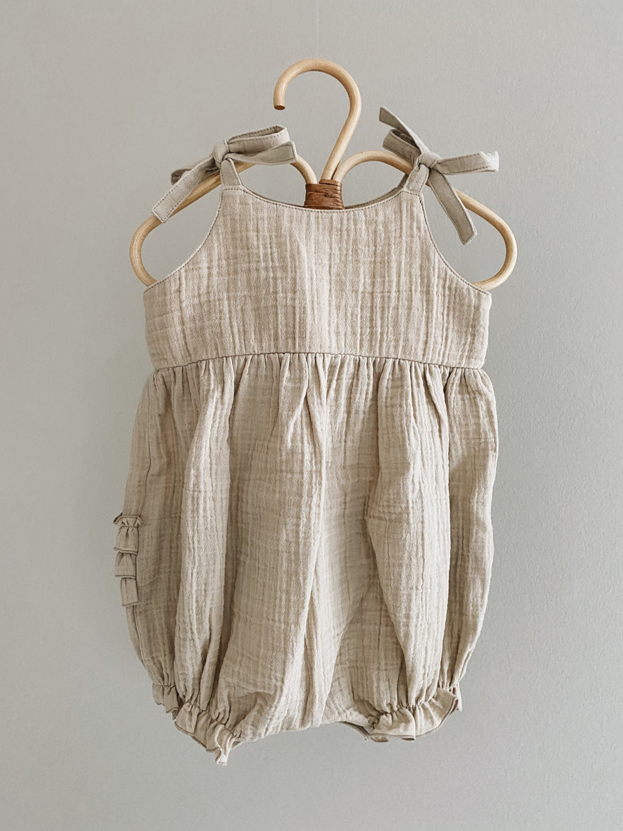 Nora romper sand