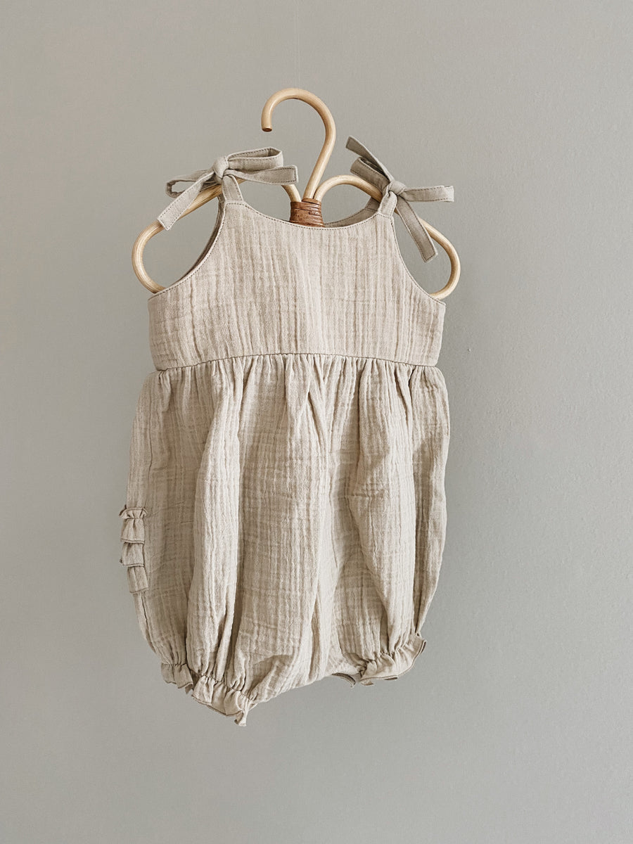 Nora romper sand